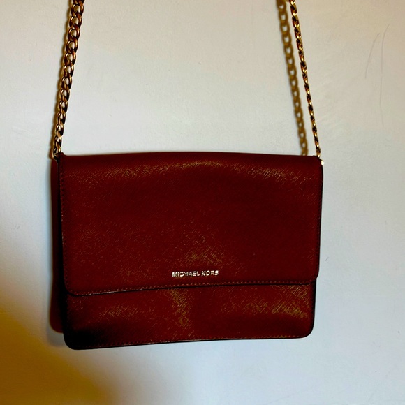 Michael Kors Handbags - Michael kors four compartament  excelent condition  dimension. 8 by 6 inchs